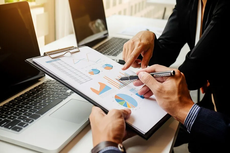 Accountant reviewing business financial reports and bookkeeping records